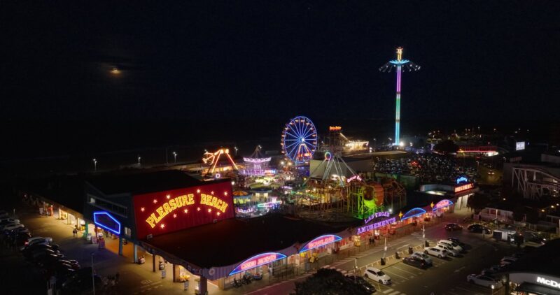 Skegness seafront and funfair lit up at night, filmed for the Great Grid Upgrade