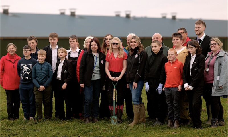 A school group gathered outdoors for the National Trust schools collaboration
